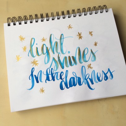 a random lettering sketch with watercolor and finetec gold ink